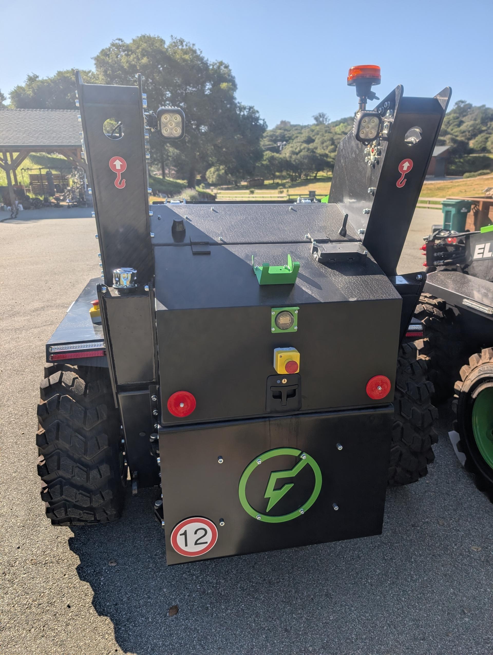 Electric skid steer rear view showing battery and controls