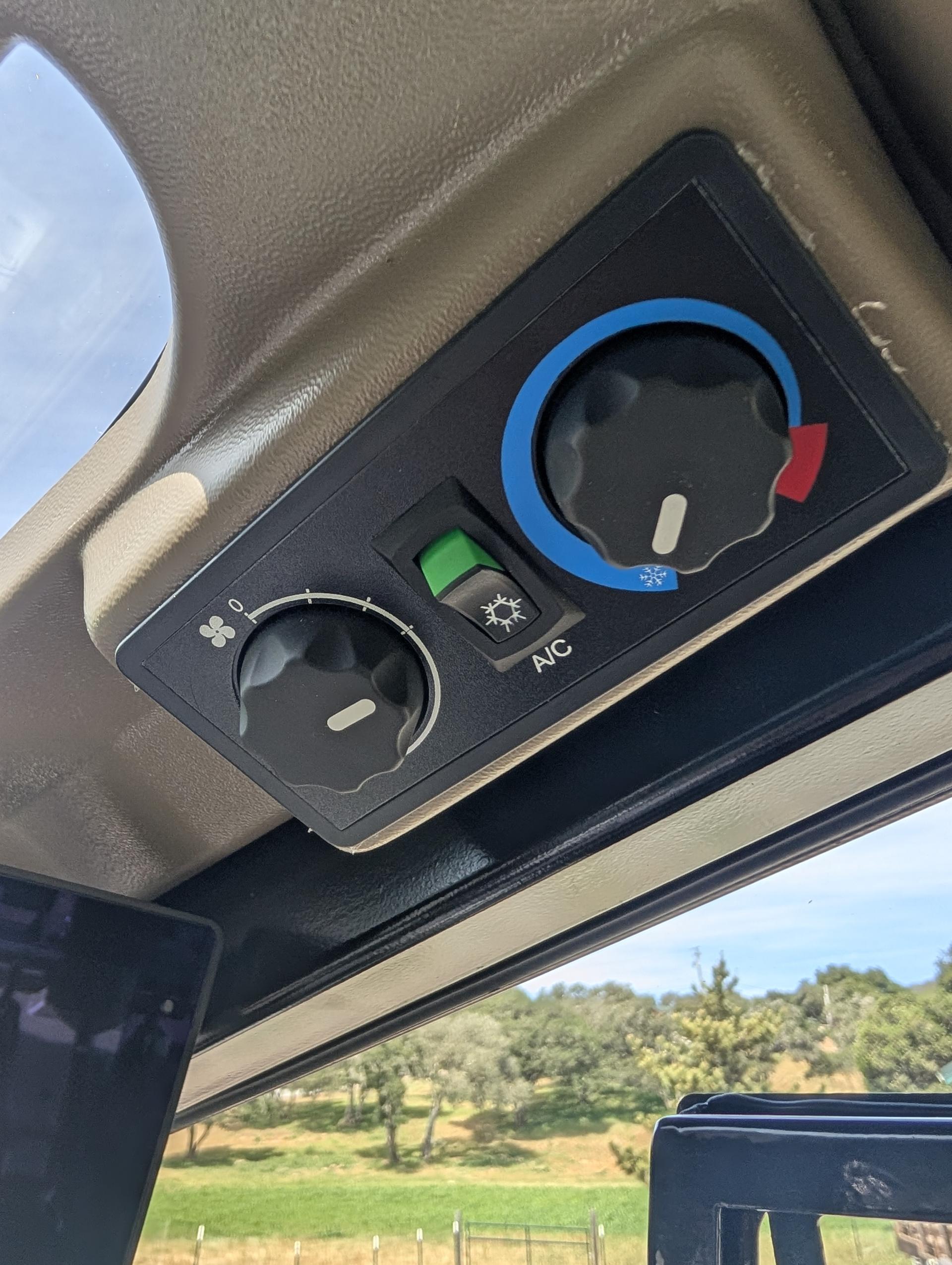 Climate control panel with A/C in enclosed cab